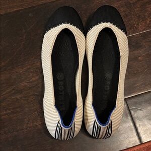 Rothy's Black and Cream Flats with Blue Accent